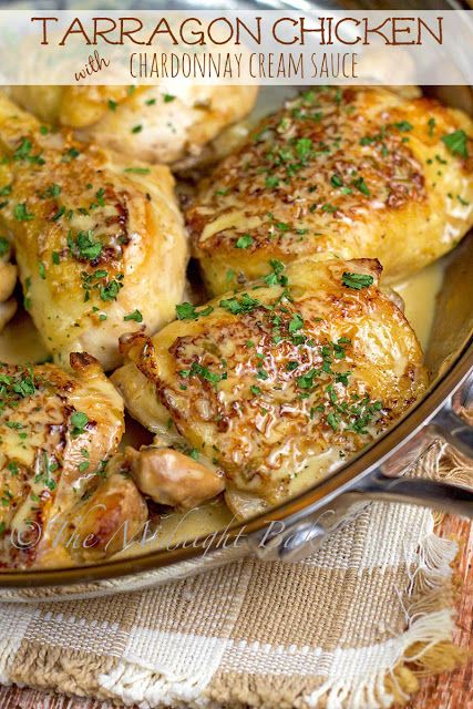 chicken with parsley on top in a skillet and garnished with herbs