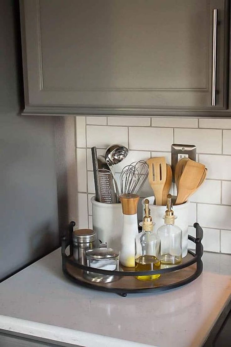 a kitchen counter with utensils and other items on the tray in front of it