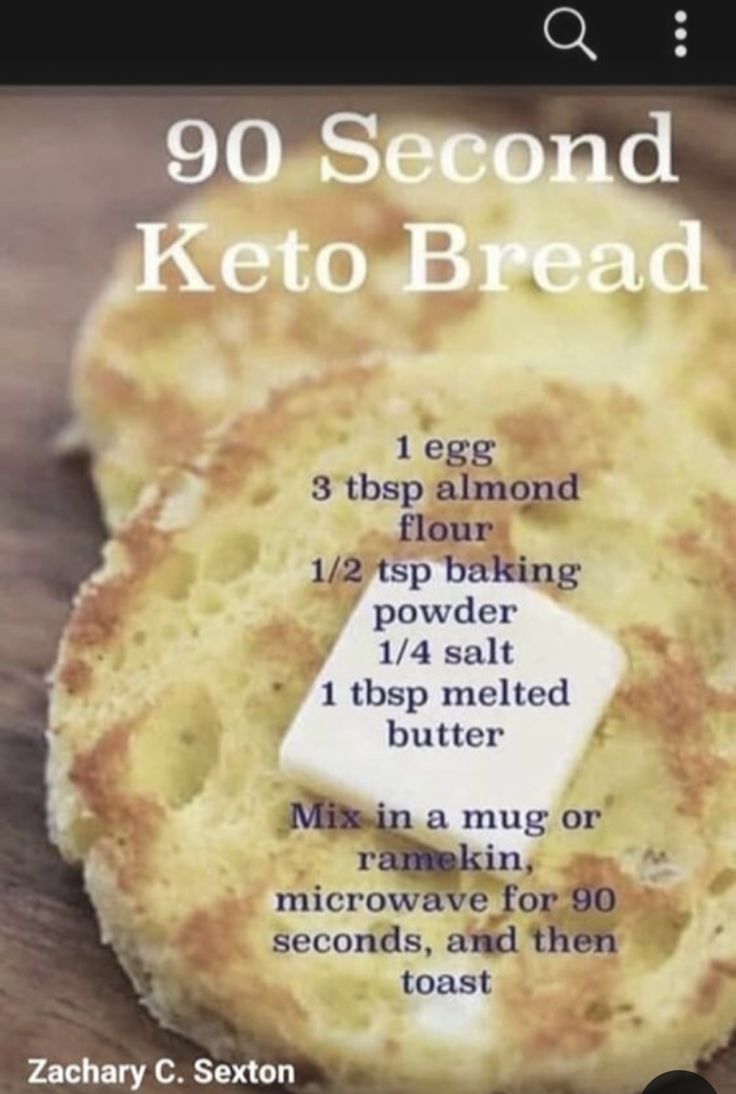 a close up of a piece of bread on a wooden table with the words 90 second keto bread