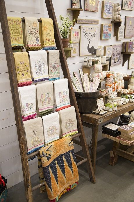 a room filled with lots of different types of cloths and pictures on the wall