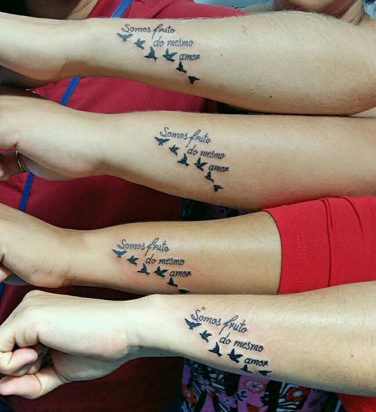 three people with matching tattoos on their arms