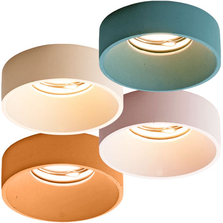 three circular lights are shown in different colors and shapes, with one light on the ceiling