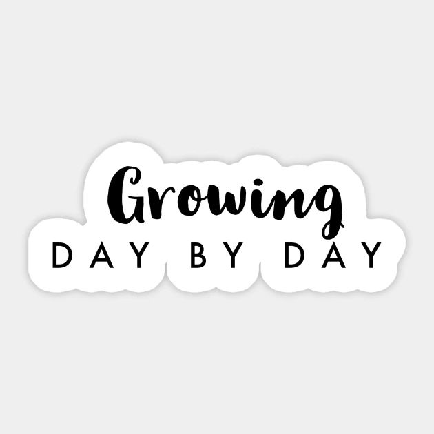 a sticker that says growing day by day