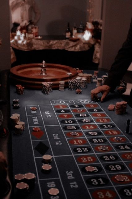 a casino table with lots of chips on it