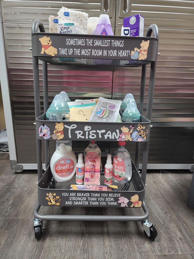 three tiered cart with baby products on it