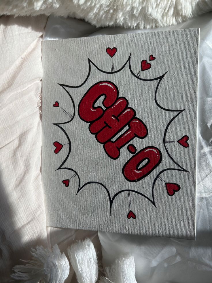 a piece of paper with the word sale written on it and hearts in red ink