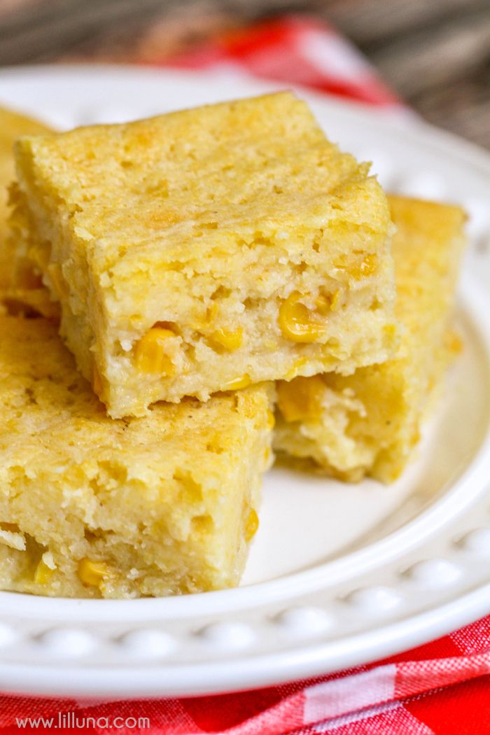 three pieces of cornbread on a white plate