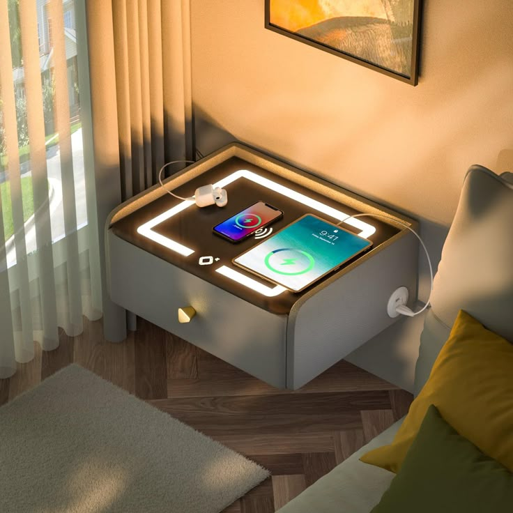 an electronic device is sitting on top of a table in the middle of a living room