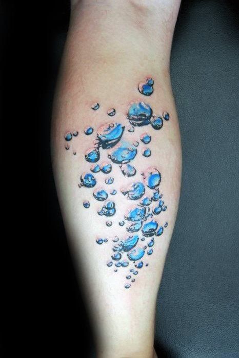 a person's leg with water droplets on it