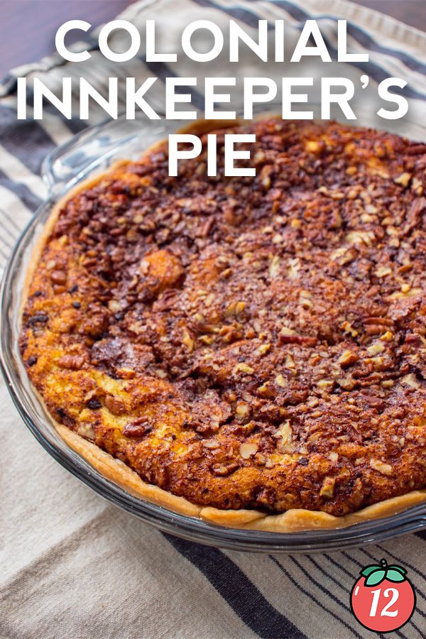 a close up of a pie on a table with the words colonial inkkeeper's pie