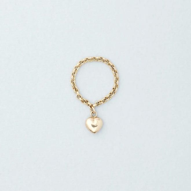 One of our best sellers, this Puffed Heart Ring on a roll chain ring brings a new take on a fun charm ring. Details:Dainty puffed heart charm dangling from a rolo chain ring - puffed heart 1/4" - delicate gold rolo chain - 14k yellow gold Free Shipping on Domestic Orders Materials: 14k Yellow Gold Need your ring bigger than whats offered? An additional fee will be applied to ring orders larger than size 8. Please contact us for exact pricing or feel free to place your order and we will send you Ring With Dangling Charm, Charm Rings Dangle, Dangle Rings, Personalized Gold Rings, Dangle Ring, Chain Ring Gold, Wire Jewelry Making, Charm Ring, Puffed Heart