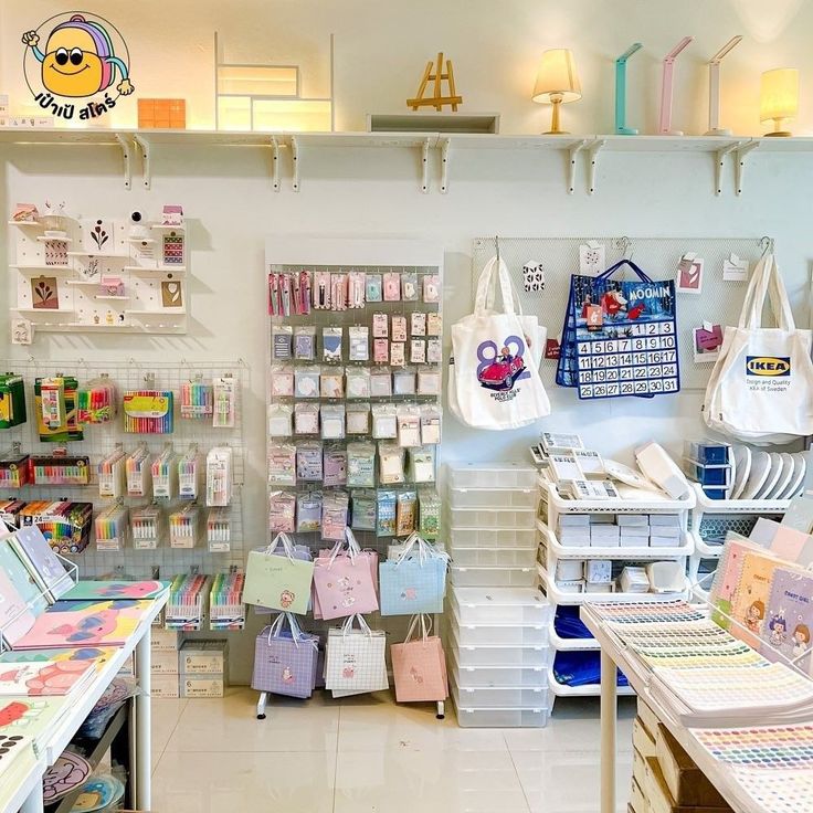 the inside of a children's store with lots of items on shelves and bags hanging from the ceiling