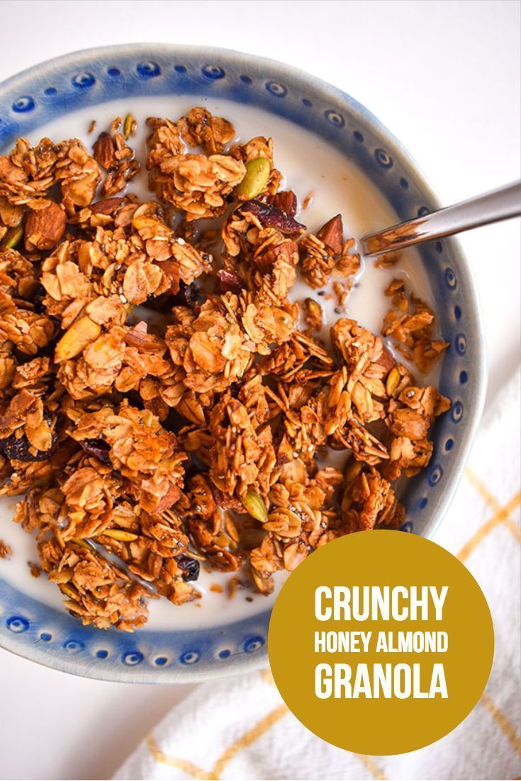 a bowl filled with granola on top of a table