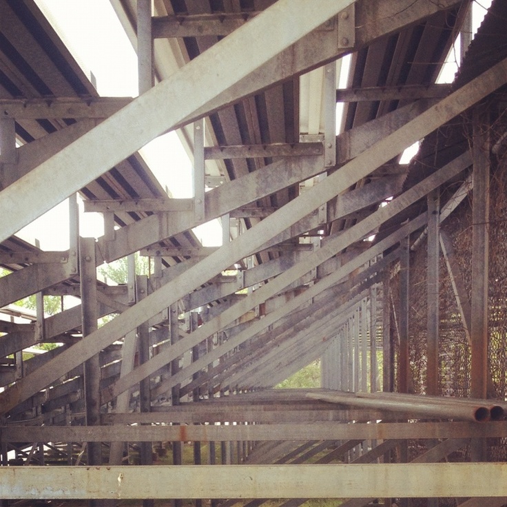 the inside of an old building with wooden beams