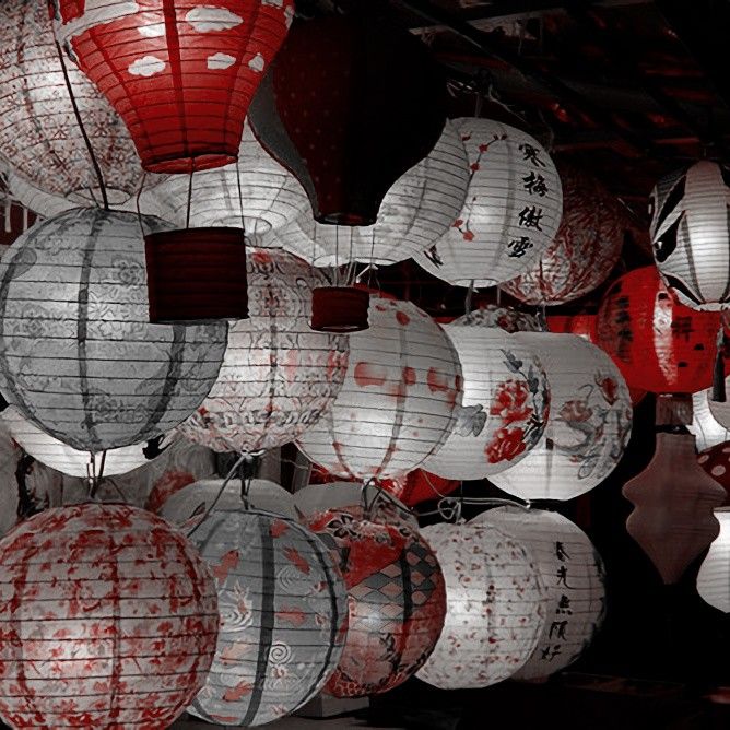 many red and white lanterns hanging from the ceiling