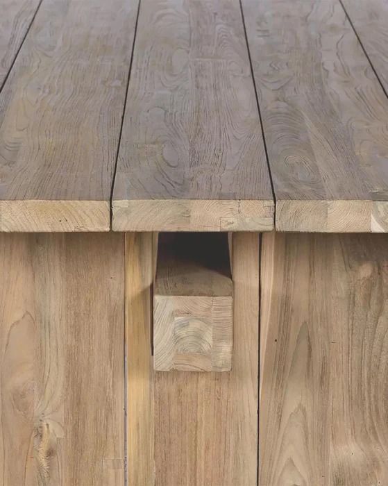 a close up of a wooden table with wood planks on it's sides