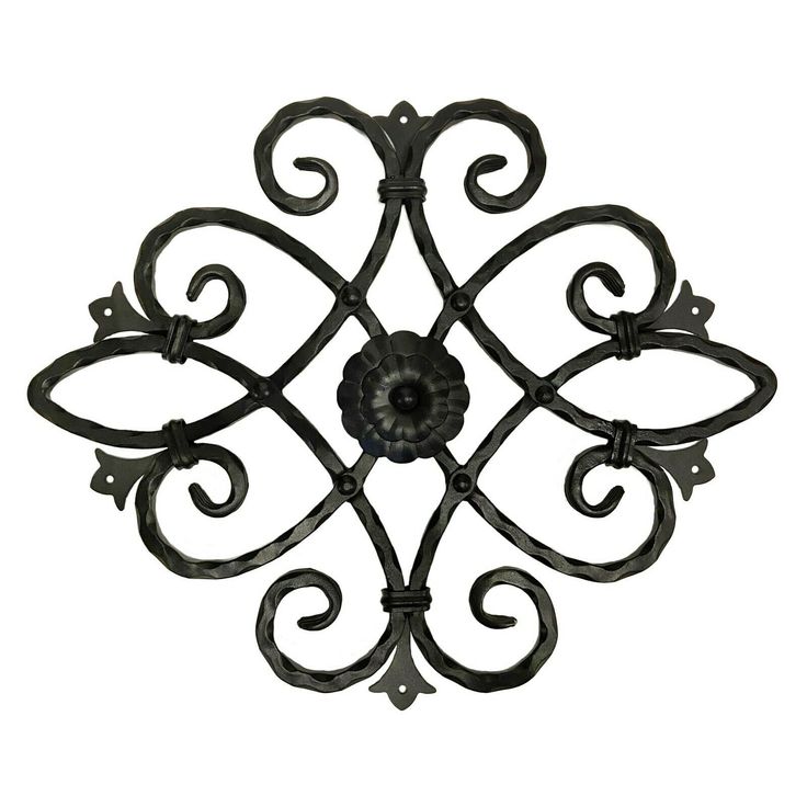 an iron wall decoration on a white background