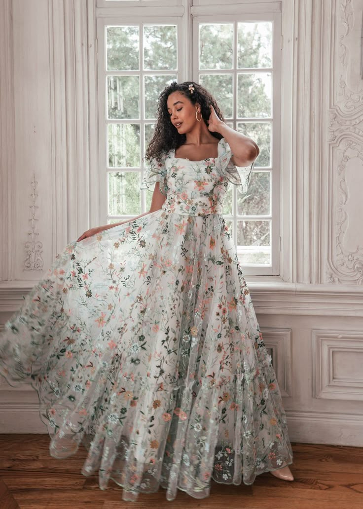 First Day of Forever Love is in full bloom. Adorned with lush embroidered florals, this exquisite gown exudes the elegance of spring. A ruched, accentuated bodice paired with flutter sleeves imbues a sense of gentle beauty. Scalloped edges at the hem and lined along the sleeves remind the wearer that love is ever in th Love Is In Full Bloom, Dream Prom Dress, Embroidered Wedding Dress, Exquisite Gowns, Floral Wedding Dress, Floral Gown, Grad Dresses, Gala Dresses, In Full Bloom