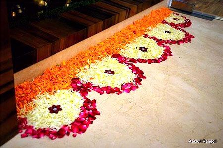 an arrangement of flowers arranged on the floor