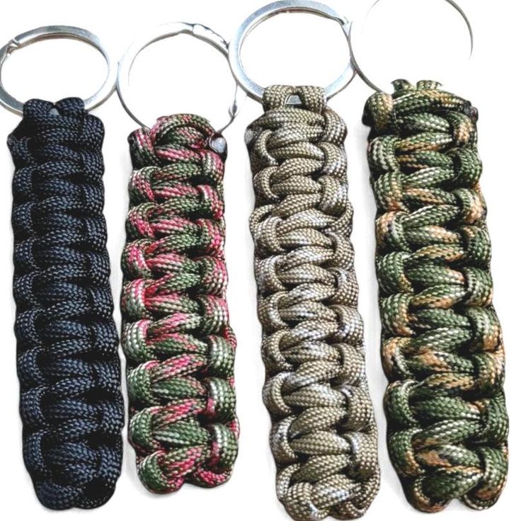 four different types of paracorine key chains with metal rings on each one side