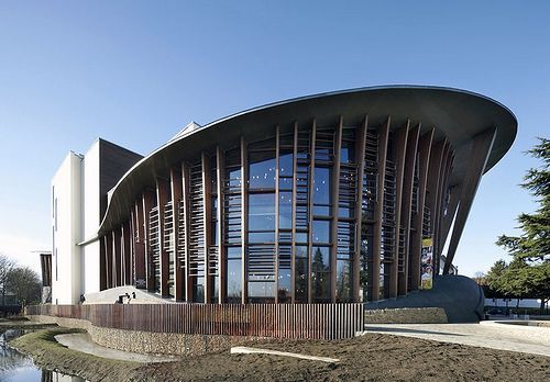 a large building that is next to a body of water