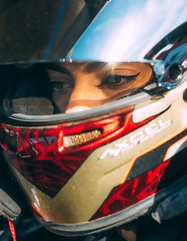 a close up of a person wearing a motorcycle helmet