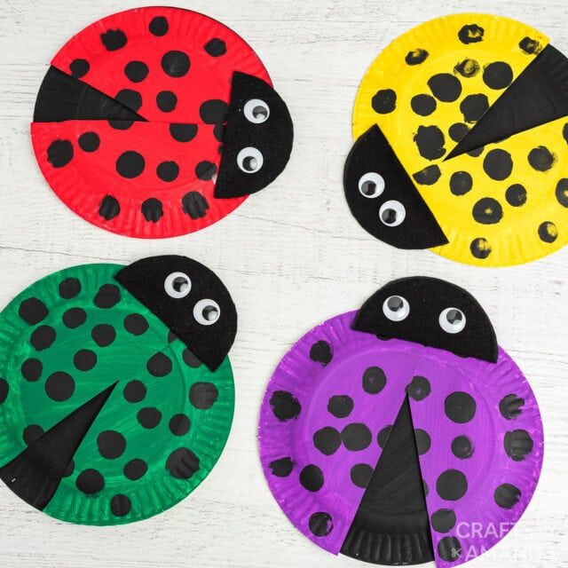 four paper plates with ladybugs on them and one has eyes painted on it