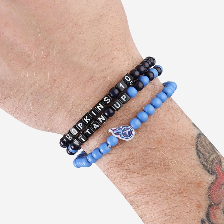 A whole new way to rep the team in style is here. Step up your fan fashion sense with this Derrick Henry & DeAndre Hopkins Tennessee Titans 3 Pack Player Beaded Friendship Bracelet. These matching friendship bracelets have an all-over team-colored design and team logo displays, which makes them the perfect way to show your support for the Tennessee Titans on gamedays and every day in between. Every bead bracelet design is the perfect addition to your outfit, whether you’re heading to the game, w Matching Friendship Bracelets, Derrick Henry, Deandre Hopkins, Friendship Bracelets With Beads, Fan Fashion, Beads Bracelet Design, Tennessee Titans, Bracelet Design, Bead Bracelets