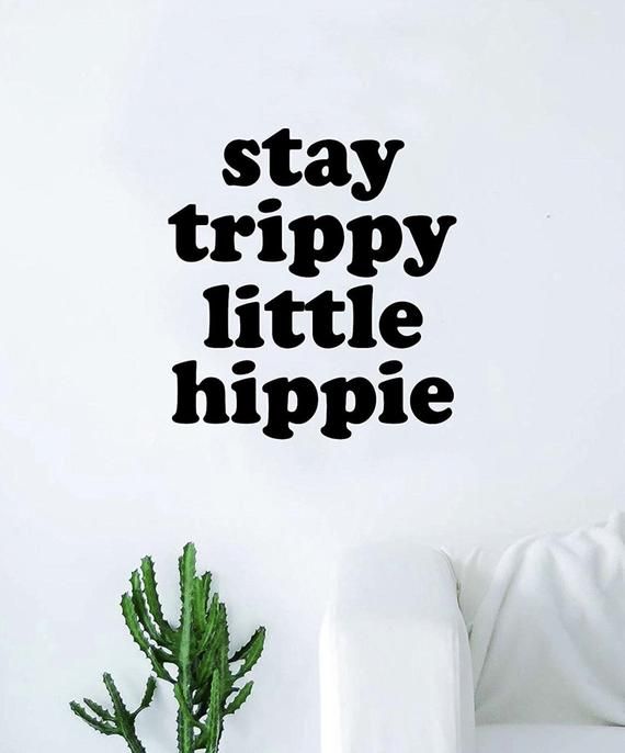 a wall decal that says stay trippy little hippie in black on a white background