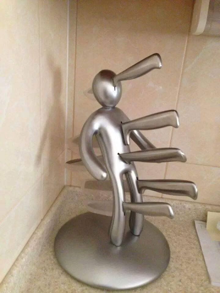 a metal sculpture sitting on top of a sink