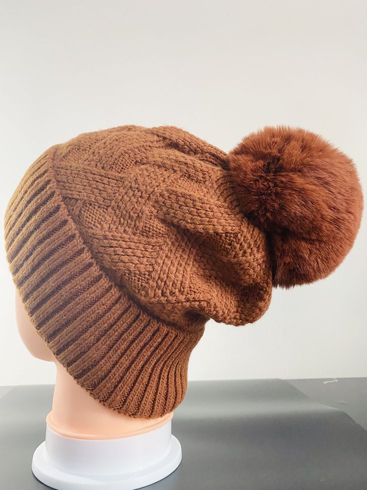 Fits both teenage girls and adult ladies. With their stretchy construction, the fleece lined hat is one-size-fits-most. Material: 70% Acrylic, 30% Wool Full Fleece Lining inside which will keep you warm and cozy. The pom pom is made of faux fur and has the soft touch. It's suitable for everyday wear and will be the perfect gifts . Knitted Winter Bonnet Cap, Warm Bonnet Cap For Fall, Warm Solid Color Bonnet, One Size, Warm Fall Bonnet Cap, Warm Solid Color One Size Bonnet, Solid Bonnet For Cold Weather One Size, Solid Bonnet For Cold Weather, Solid One-size Bonnet For Cold Weather, Winter Soft Knit Bonnet, One Size Fits Most