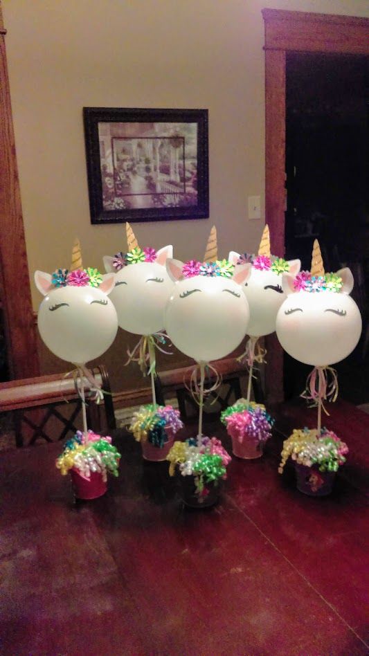 balloons with unicorn heads and flowers in them