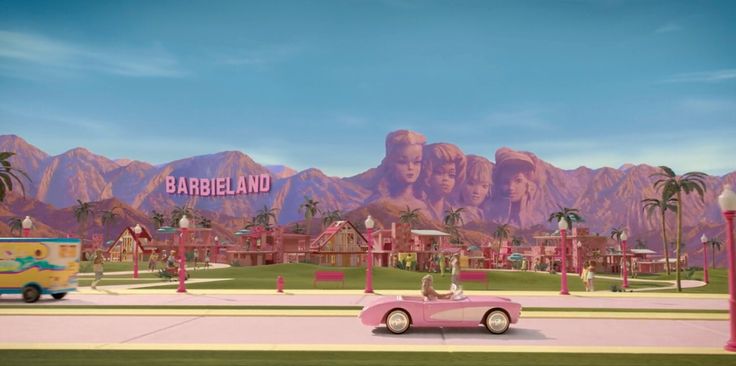 a pink car parked in front of a sign that says barbieland