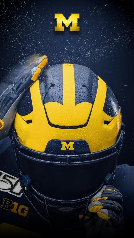 the michigan wolverines football helmet is shown in front of a black background with yellow lettering