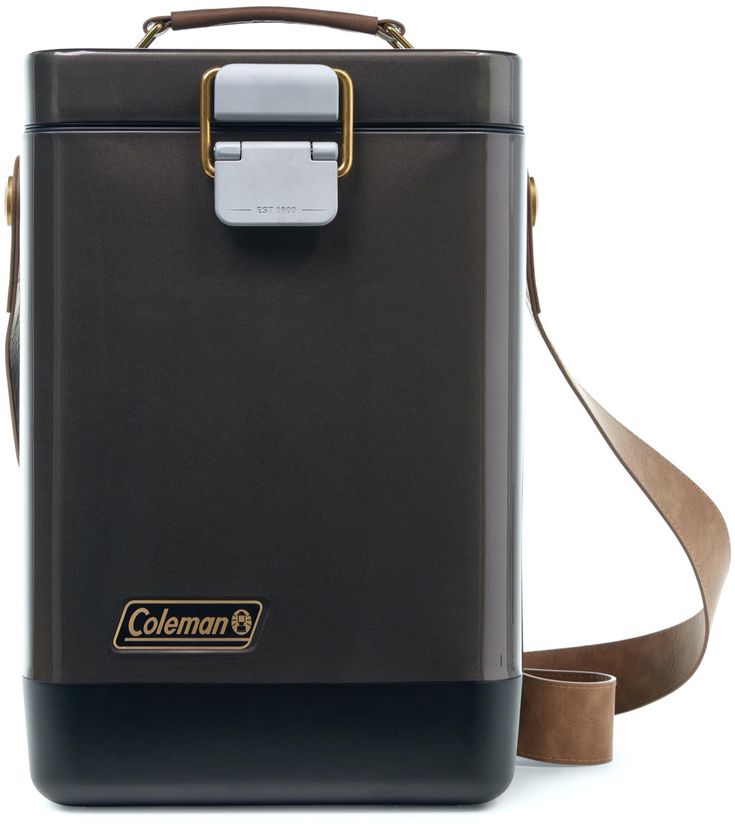 a black and brown cooler sitting on top of a white table next to a brown strap