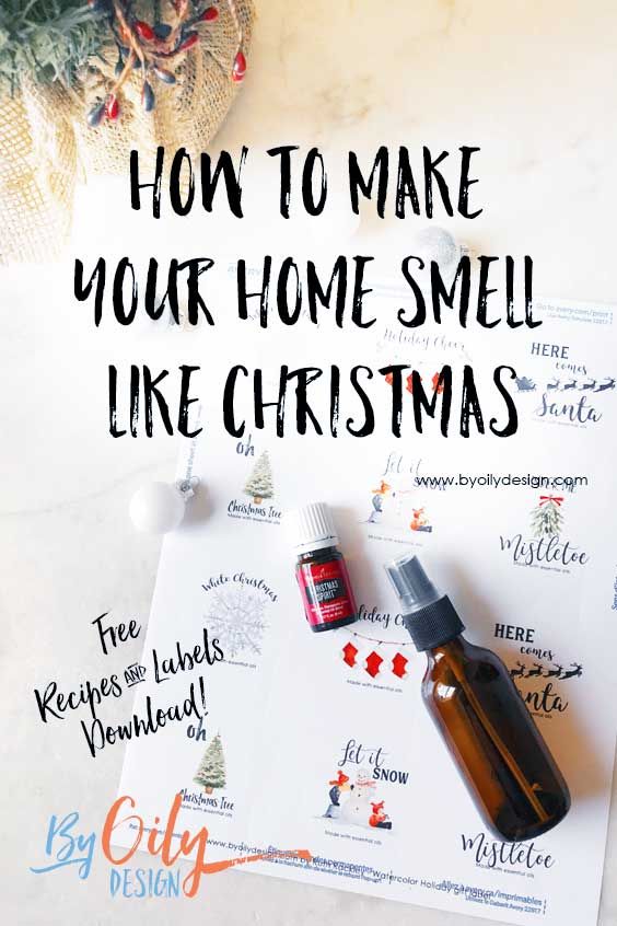 a bottle of essential oils sitting on top of a paper with the words how to make your home smell like christmas