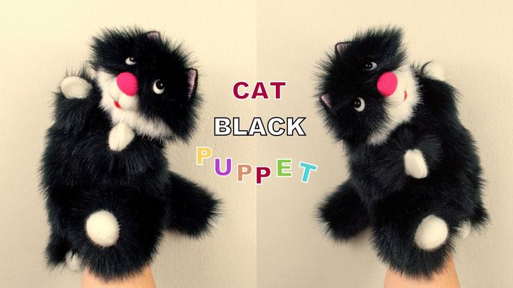 two stuffed animals with pink noses and black furs on their hands, one is holding the other's paw