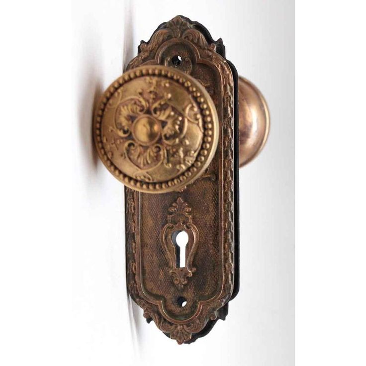 an ornate door handle with a keyhole on the front and back side of it