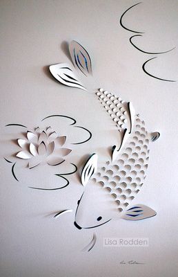 some paper cut flowers and fish on a white wall