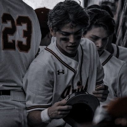 a group of baseball players standing next to each other