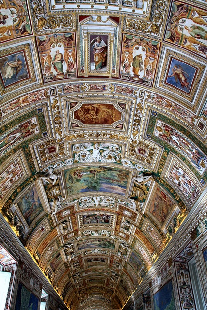 an ornate ceiling with paintings on it