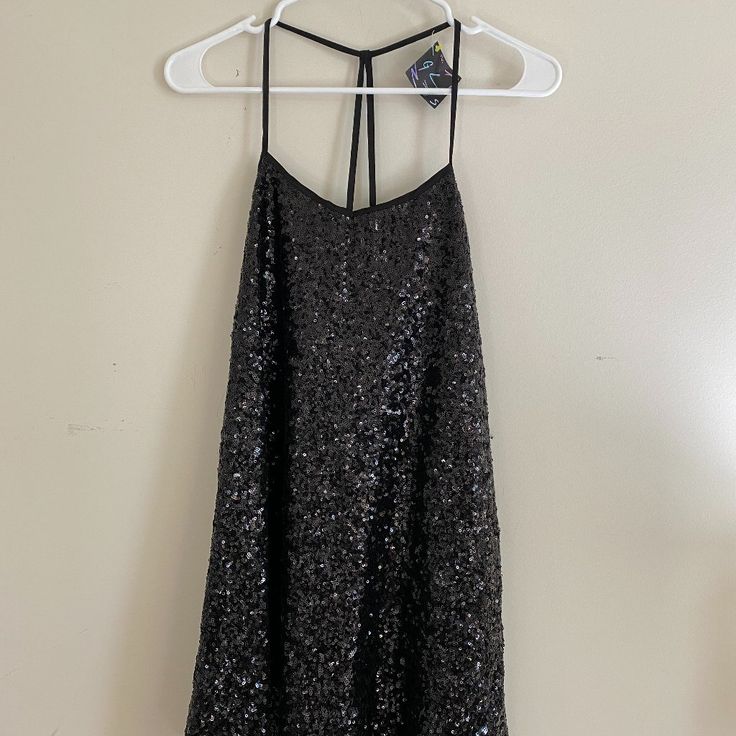 Nastygal Black Sequin Party And/Or Cocktail Dress. Size Small, Can Fit A Small Or Medium. Tags Still Attached. Dress Has T-Back Straps, With Wide V-Neck That Covers Chest. Dress Hits Right Above Knee For Females 5'5" And Below. Great For Parties, Girls Night Out, Clubbing, Or Cocktail Dress. Black Sequined Mini Dress For Prom, Black Backless Sequin Prom Dress, Holiday Evening Backless Mini Dress, Black Mini Length Sequin Prom Dress, Chic Black Sequin Dress For Prom Season, Chic Black Sequin Dress For Prom, Black Holiday Party Evening Dress, Black Backless Holiday Dress, Black Sequin Dress For Prom Season Night Out