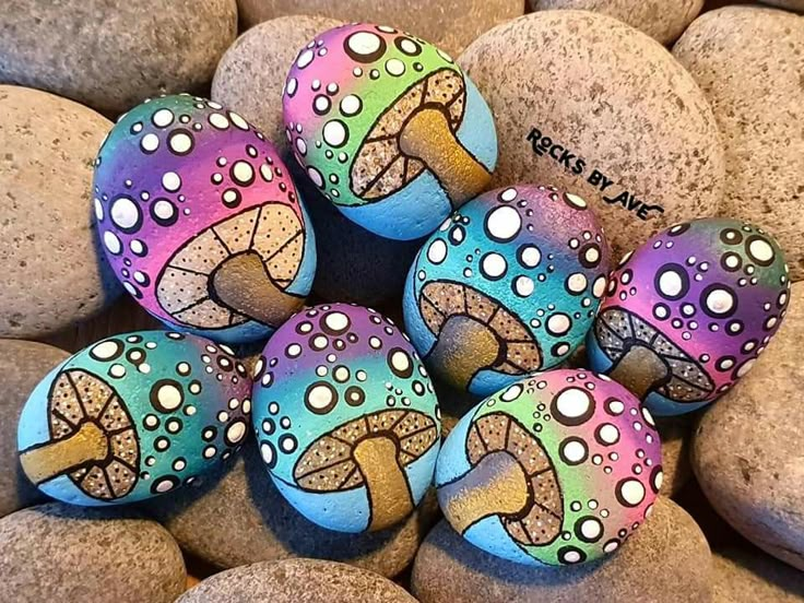 painted rocks with different designs on them