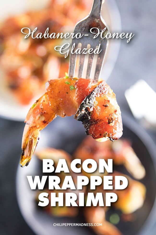 bacon wrapped shrimp on a fork with text overlay that reads rabapeno honey glazed baked bacon wrapped shrimp