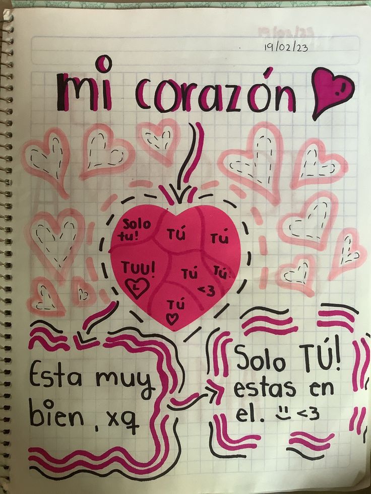 a notebook with writing on it that says mi coran and has hearts in the middle