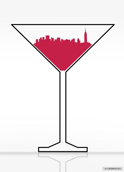 a martini glass with a city skyline in the background