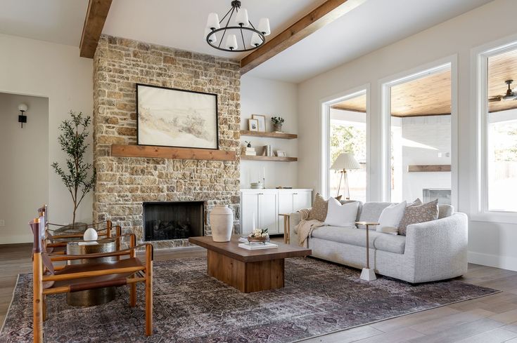 a living room filled with furniture and a fire place