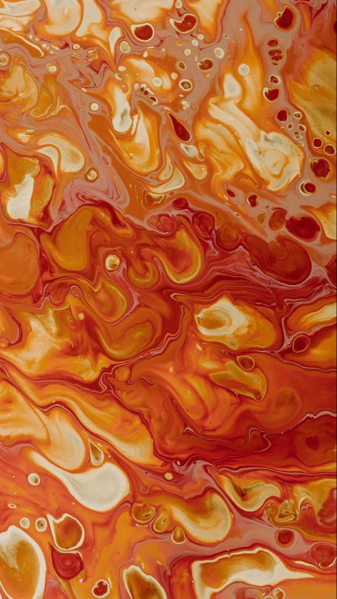 an orange and yellow fluid painting with lots of bubbles in the air on top of it