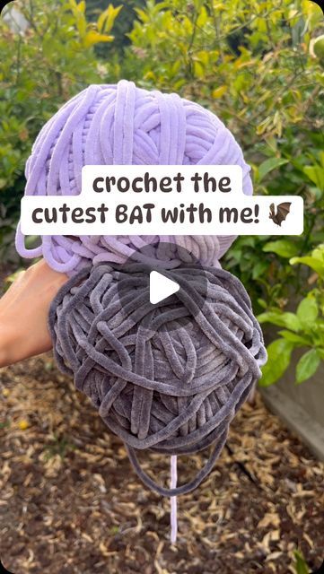 a ball of yarn sitting on top of a stick with the words crochet the cutest bat with me