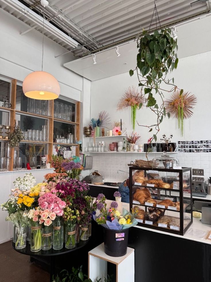 a flower shop filled with lots of fresh flowers